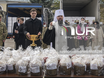 Metropolitan Epifaniy, head of the Orthodox Church of Ukraine,  sanctify Ukrainian traditional Easter breads paskas in front of the St Micha...