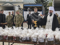 Metropolitan Epifaniy, head of the Orthodox Church of Ukraine,  sanctify Ukrainian traditional Easter breads paskas in front of the St Micha...
