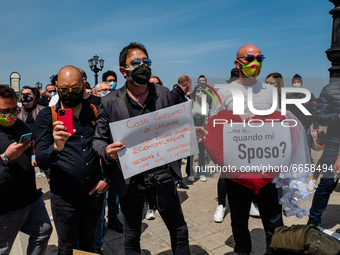 A group of deeejays protest on the Lungomare in front of the Puglia Region on the first day in the orange zone for lack of support from the...