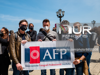 A group of photographers protest on the Lungomare in front of the Puglia Region on the first day in the orange zone for lack of support from...