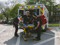 a fire fighter is carted off by EMS personnel after sustaining minor injuries of the Historic House In Palmer Square, Chicago, USA, on April...