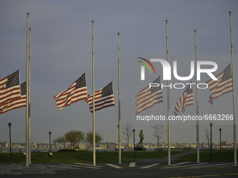 The U.S. flags were flown at half-staff at Flag Plaza in Liberty Park, New Jersey, New York on April 28, 2021, to honor the 500,000 deaths f...