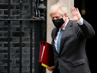 British Prime Minister Boris Johnson leaves 10 Downing Street for his weekly Prime Minister's Questions (PMQs) appearance in the House of Co...