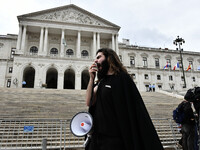 A student using a megaphone encourages the demonstrators in front of the Republic Assembly palace. April 28, 2021. Demonstrators from differ...