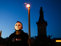 A protestor holds a torch while attending 'The List Of Shame' anti-government demonstration at the Main Square in Krakow, Poland on April 28...