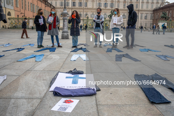 Women place jeans on the floor during a flashmob for the Denim Day promoted by  Break The Silence association to protest against gender viol...