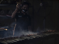 A man cookings of meat of Indonesian tradtional food were prepared for breaking fasting at Purwarkarta, West Java, indonesia, on 29 April 20...