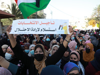 Supporters of exiled Palestinian politician and Fatah movement's former security chief, Mohammed Dahlan, demonstrate outside the Palestinian...