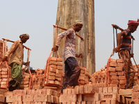 Labourers working at a brickfield on the outskirts of Dhaka, Bangladesh, on March 30, 2021 (