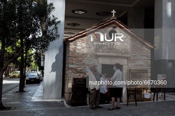 A couple after the litany outside the Agia Dynami (Holy Power) Church in Athens, Greece, on April 30, 2021.
 