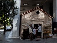 A couple after the litany outside the Agia Dynami (Holy Power) Church in Athens, Greece, on April 30, 2021.
 (