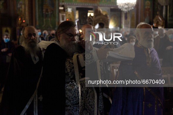 The time of the dethronement of Christ from the cross in  the church of Saint Panteleimon of Acharnai in Athens, Greece, on April 30, 2021. 