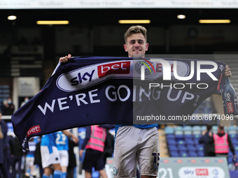  Sammie Szmodics of Peterborough United holding a we are going up banner after the Sky Bet League 1 match between Peterborough and Lincoln C...