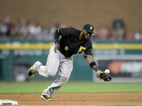 Pittsburgh Pirates' Starling Marte cannot catch the ball hit by Detroit Tigers'  J.D. Martinez in the sixth inning of a baseball game in Det...