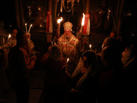 Palestinian Christian Catholics attend an Easter Vigil mass in Gaza City on May 2, 2021. Christians around the world mark the Holy Week of E...
