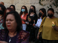 Palestinian Christian Catholics attend an Easter Vigil mass in Gaza City on May 2, 2021. Christians around the world mark the Holy Week of E...