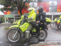 A motorcycle with a police officer and a mobile anti-riot squad in Bogota, Colombia, on May 1, 2021. In the celebration of Labor Day and the...