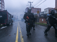 Agents of the mobile anti-riot squad trying to disperse the protesters in Bogota, Colombia, on May 1, 2021. In the celebration of Labor Day...