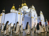 Priests of the Orthodox Church of Ukraine during the All-Night Easter Liturgy near the St Michael's Golden-Domed Cathedral in Kyiv, Ukraine,...