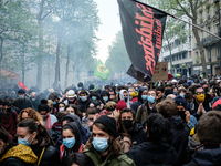 Peaceful demonstrators flee tear gas fired by the police to disperse the black bloc who were confronting the police. The traditional May Day...