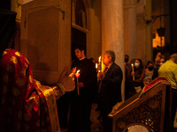 A Greek Orthodox priest at the night of the resurrection of Jesus.  On May 1, 2021 in Athens, Greece. (