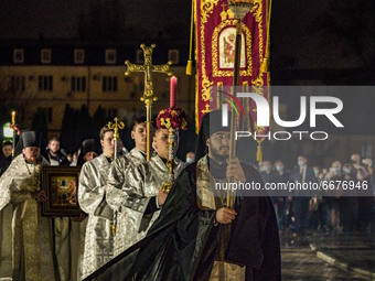 Religious procession at night around the Saint Michael Cathedral during the night celebrations of the orthodox Easter in Kiev, Ukraine. (