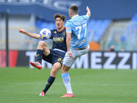 Eldor Shomurodov of Genoa CFC and Adam Marusic of SS Lazio compete for the ball during the Serie A match between SS Lazio and Genoa CFC at S...