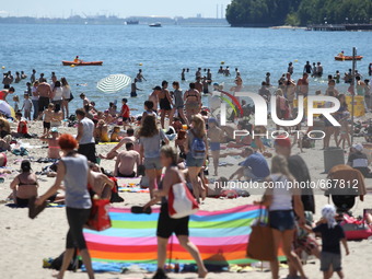 Gdynia, Poland 2nd, July 2015 Thousands of people enjoy sunbathing and swimming at the Baltic sea coast in Gdynia. Meteorologists predict ov...