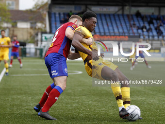  Isaac Olaofe of Sutton United being held by George Fowler of Aldershot Town during National League between Sutton United and Aldershot Town...
