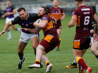 
 Michael Ward of Batley Bulldogs is tackled by Ted Chapelhow of Newcastle Thunder during the BETFRED Championship match between Newcastle T...