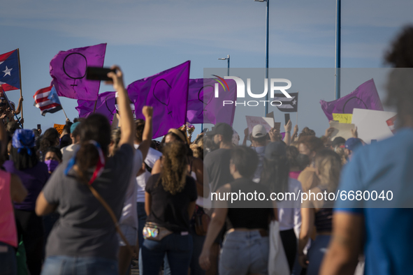 People gather at the Teodoro Moscoso bridge in order to protest and demand justice for the most recent feminiced against Keishla Rodríguez a...