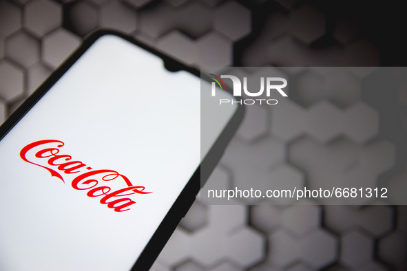 In this photo illustration a Coca Cola logo seen displayed on a smartphone screen in Athens, Greece on May 3, 2021. (Photo illustration by N...
