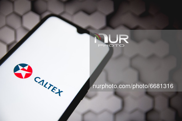In this photo illustration a Caltex logo seen displayed on a smartphone screen in Athens, Greece on May 3, 2021. (Photo illustration by Niko...