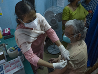   A health care officer is inoculating a dosage of Bharat Biotech's Covaxin vaccine during the mass vaccination drive.On May 4, 2021 in Kolk...