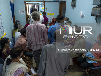   People are waiting in a queue for vaccination without maintaining proper social distancing norms in a Govt hospital. On May 4, 2021 in Kol...