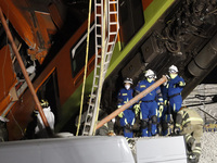  A member of rescue squad  is seen during the rescue the bodies of the victims where Mexico City subway olivos station overpass collapsed, k...