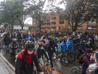 People walk through the north of Bogota. In the national strike that completes seven days, people protesting against the government of Colom...