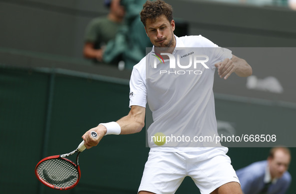 (150702) -- WIMBLEDON, July 2, 2015 () -- Robin Haase of the Netherlands returns a shot during the men's singles second round against Andy M...