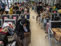 People waiting for the train at the station in Jakarta, Indonesia, on 05 May 2021. People filled in senen station, jakarta for coming home a...