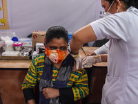 Women gets vaccine against COVID-19 coronavirus disease, at a vaccination centre in Guwahati, India on 05 May 2021. India has opened up vacc...
