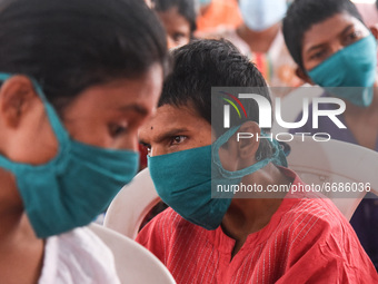 Beneficiaries waits to get vaccine against COVID-19 coronavirus disease, at a vaccination centre in Guwahati, India on 05 May 2021. India ha...