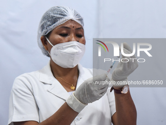 A health worker praparing a dose of COVID-19 vaccine, at a vaccination centre in Guwahati, India on 05 May 2021. India has opened up vaccina...