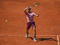 Carlos Alcaraz of Spain in action  during his second round match against Rafael Nadal of Spain during day seven of the Mutua Madrid Open at...
