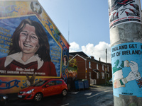 A sticker 'England Get Out Of Ireland' in front of the memorial mural to Bobby Sands by Irish artist and former Irish Republican Army member...
