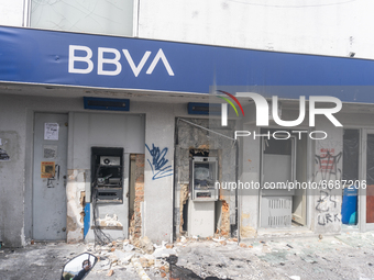 View of a BBVA Bank destroyed during clashes between demonstrators and riot police officers in the protests against the government's tax ref...