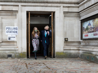 LONDON, UNITED KINGDOM - MAY 06, 2021: British Prime Minister Boris Johnson and his fiancee Carrie Symonds leave a polling station at Method...