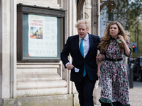 LONDON, UNITED KINGDOM - MAY 06, 2021: British Prime Minister Boris Johnson and his fiancee Carrie Symonds walk to a polling station at Meth...