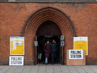 LONDON, UNITED KINGDOM - MAY 06, 2021: People leave a polling station at St Andrew's Parish Church in Earlsfied in South West London after c...