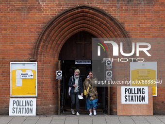 LONDON, UNITED KINGDOM - MAY 06, 2021: People leave a polling station at St Andrew's Parish Church in Earlsfied in South West London after c...