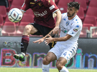 Giovanni Crociata of Empoli FC and Norbert Gyomber of US Salernitana 1919 compete for the ball during the Serie B match between US Salernita...